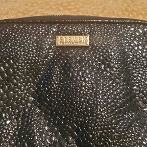 STEVEN by Steve Madden padded tablet case.